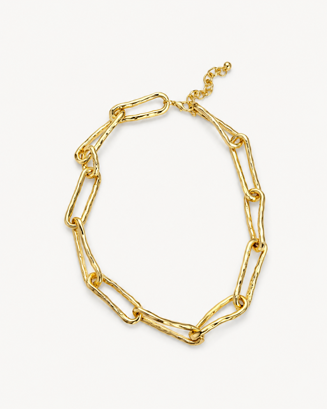 Hammered link chain necklace in polished gold with oversized elongated links, organic textured finish and sculptural statement design by RRule