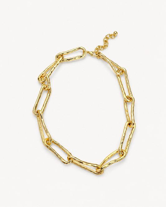Hammered link chain necklace in polished gold with oversized elongated links, organic textured finish and sculptural statement design by RRule