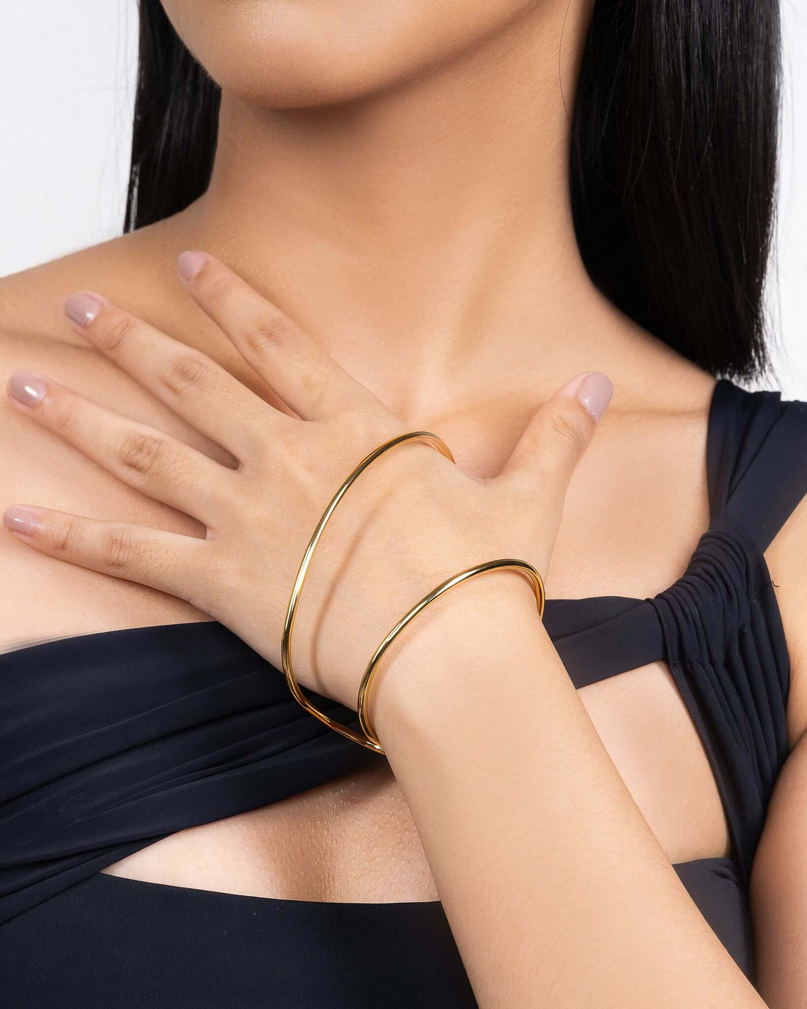 Sculptural palm bracelet in gold tone, modern statement hand bracelet with open cuff design, minimalist arm jewelry for women, bold contemporary gold bracelet, elegant fashion accessory for special occasions or everyday styling