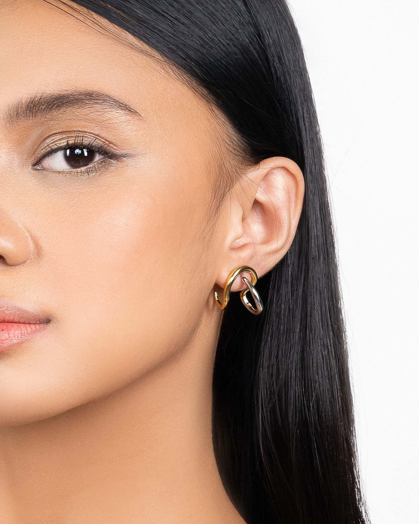 Two tone sculptural stud earrings in gold and silver finish, modern mixed metal statement earrings for women, abstract chunky stud earrings, contemporary minimalist jewelry, bold everyday earrings for casual or elevated styling
