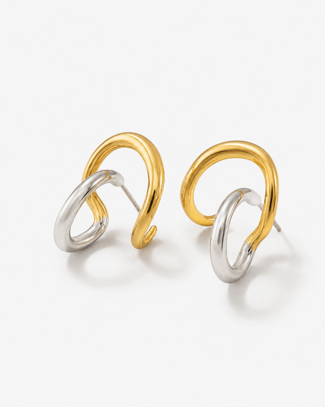 Two tone sculptural stud earrings in gold and silver finish, modern mixed metal statement earrings for women, abstract chunky stud earrings, contemporary minimalist jewelry, bold everyday earrings for casual or elevated styling