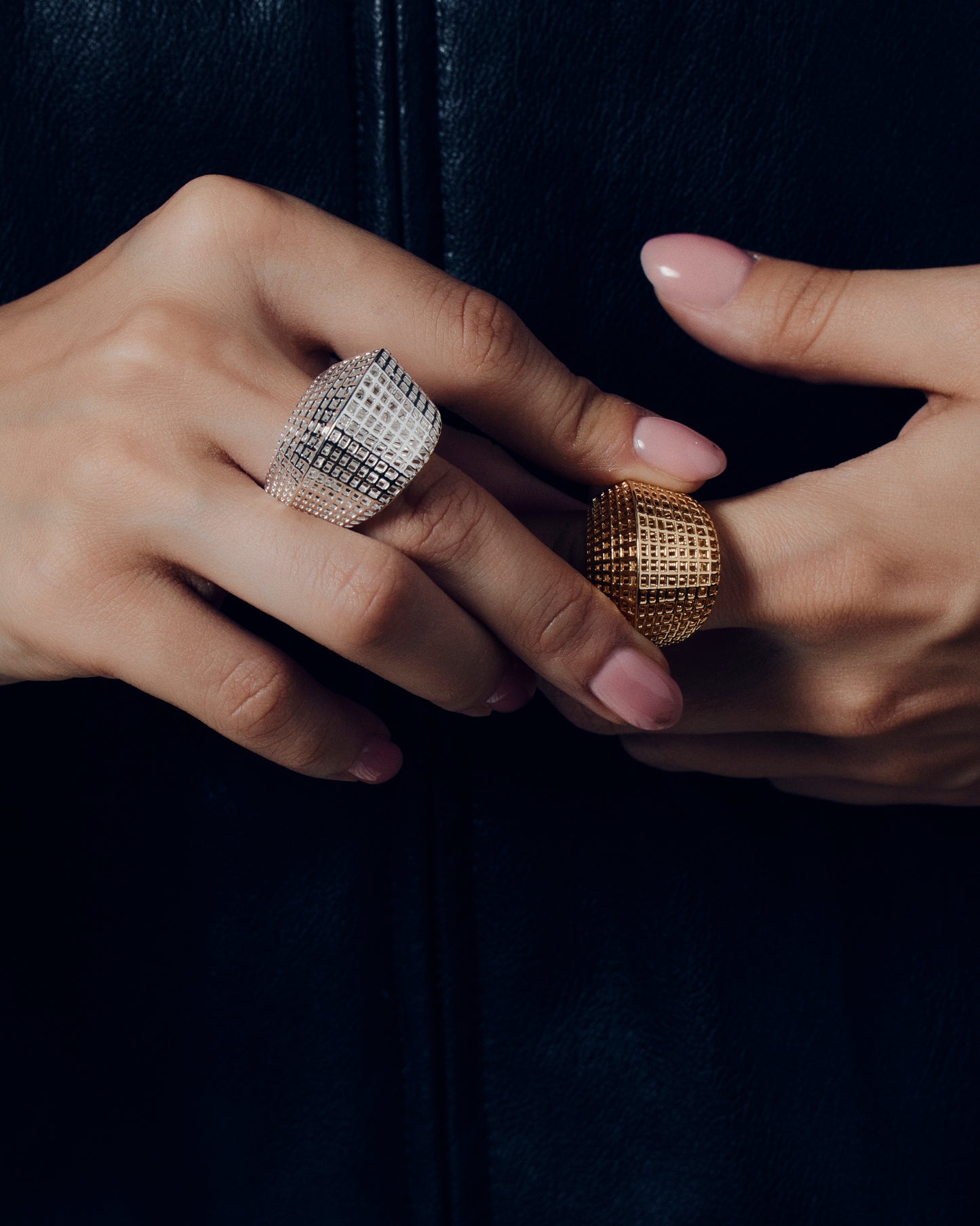 Gold open-work grid ring with a sculptural geometric pattern and bold rounded band. This chunky gold statement ring features a modern lattice texture that gives it depth and dimension while remaining lightweight and comfortable. Crafted in polished gold-tone metal, it adds a refined, architectural edge to everyday or occasion wear.
