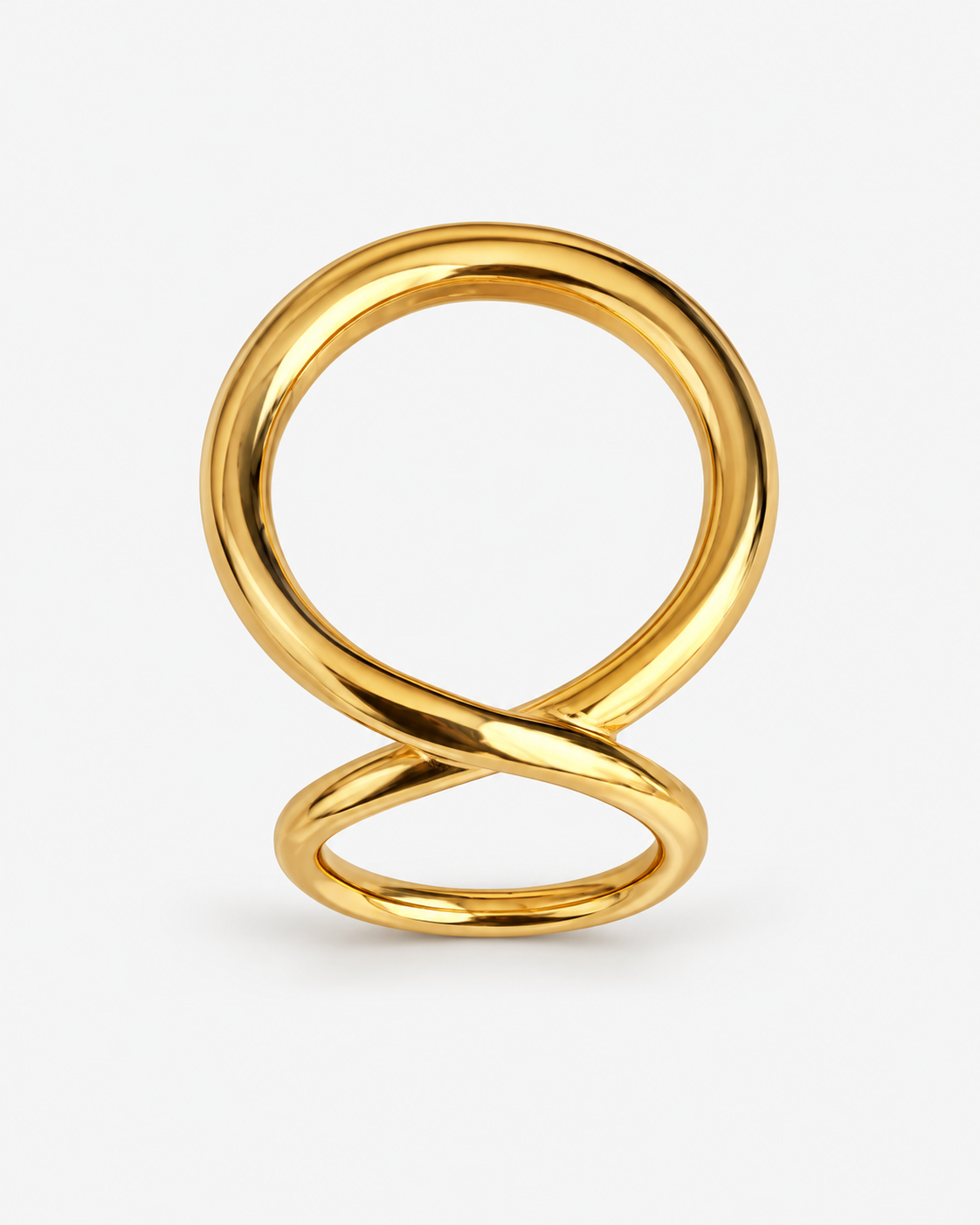 Sculptural loop ring in polished gold and silver with an oversized fluid open-loop silhouette and modern statement design by RRule
