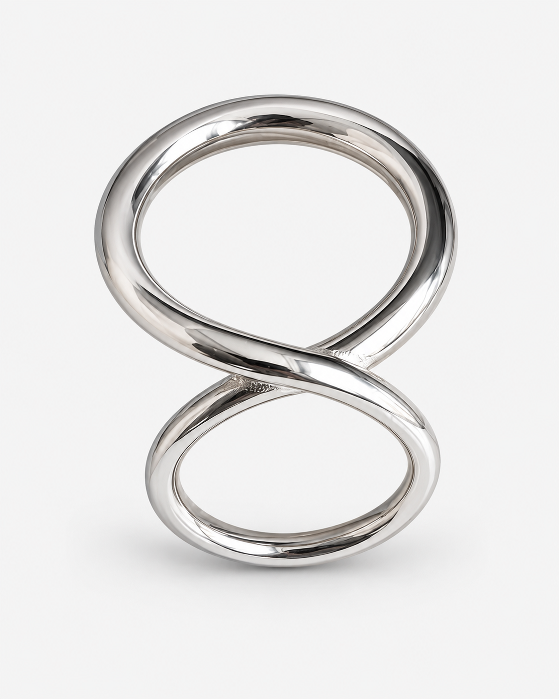 A polished silver infinity symbol ring with a smooth, reflective metallic finish, photographed on a clean white background.