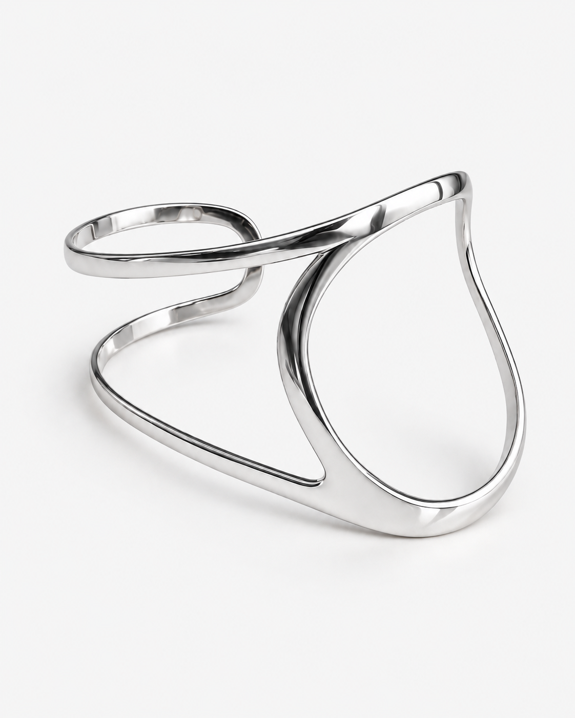 Palm cuff bracelet in gold and silver featuring a polished fluid silhouette, sculptural open hand bracelet design and modern statement jewelry by RRule