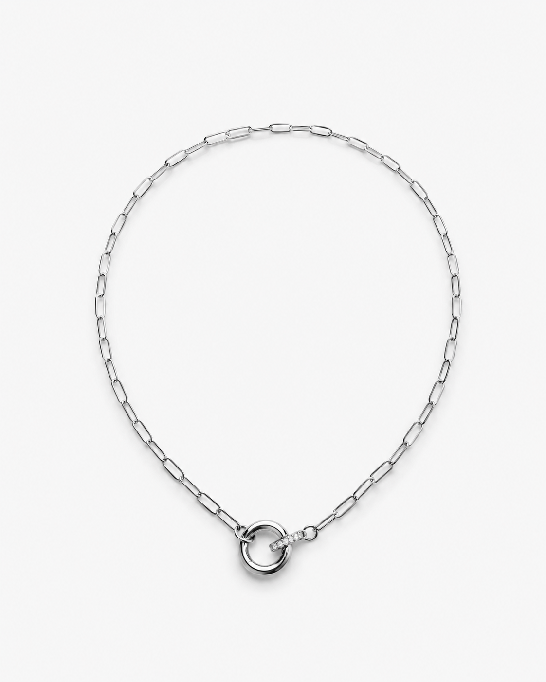 Paperclip Toggle Charm Necklace in gold and silver with elongated links, circular toggle clasp and sparkling zircon charm detail by RRule.
