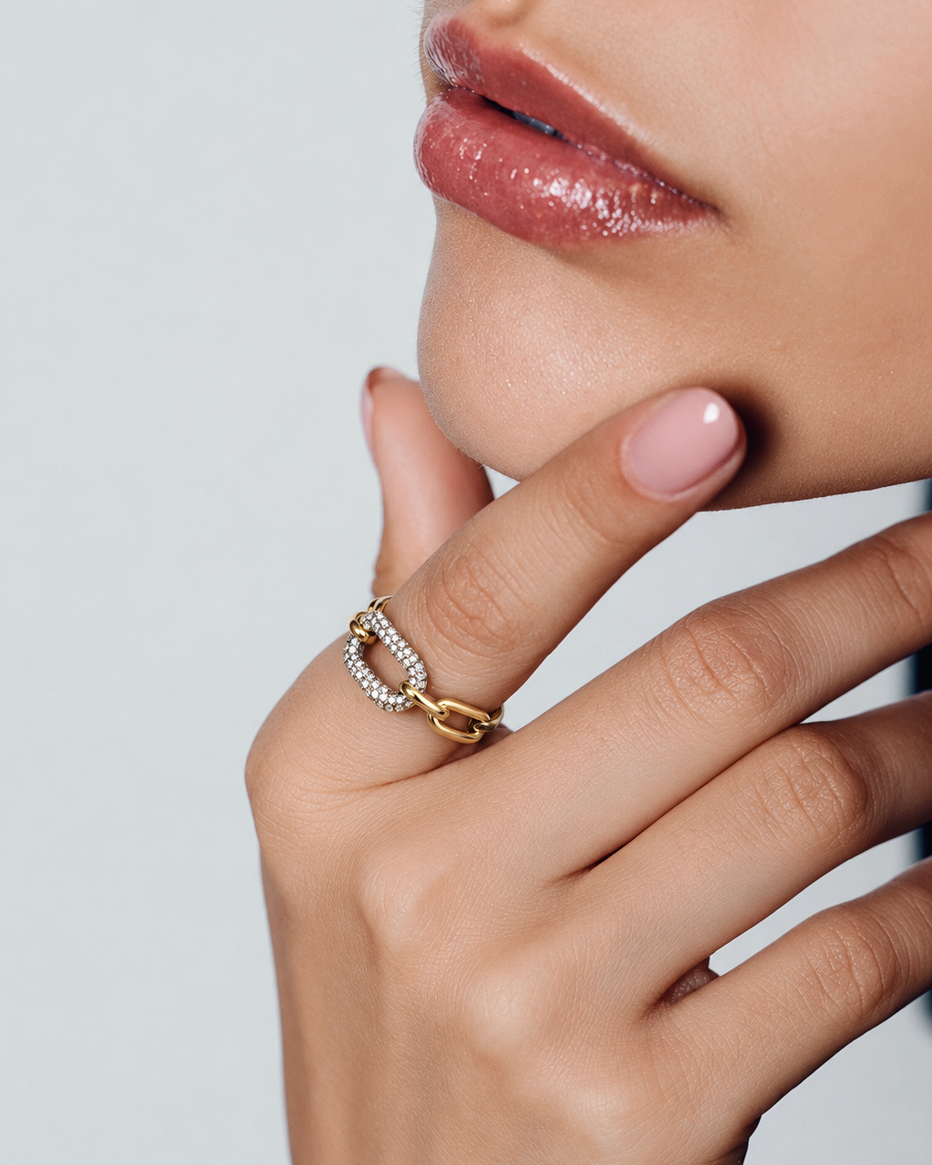 Pavé chain link ring in polished gold with interlocking links, sparkling crystal accents and sculptural statement design by RRule