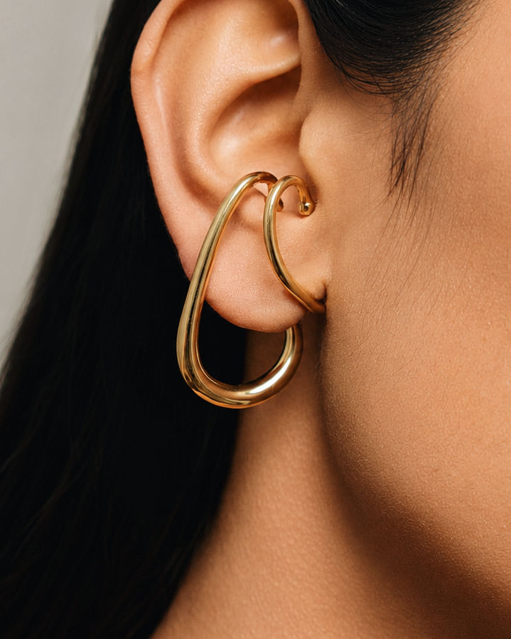 chunky gold hanging ear cuff with oversized teardrop hoop design, no piercing ear cuff earring for women, modern sculptural gold ear wrap jewelry, statement chunky ear cuff with elegant dangle silhouette, waterproof hypoallergenic fashion jewelry for everyday wear and special occasions