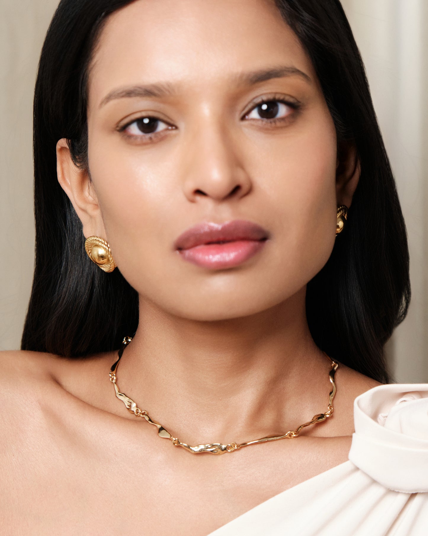 Gold rope dome stud earrings with textured twisted border and polished finish