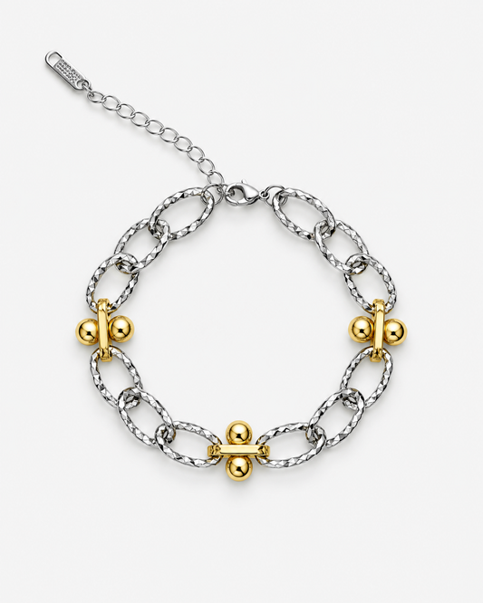 A silver-toned chain bracelet with four gold-toned decorative links, displayed on a clean light gray background.