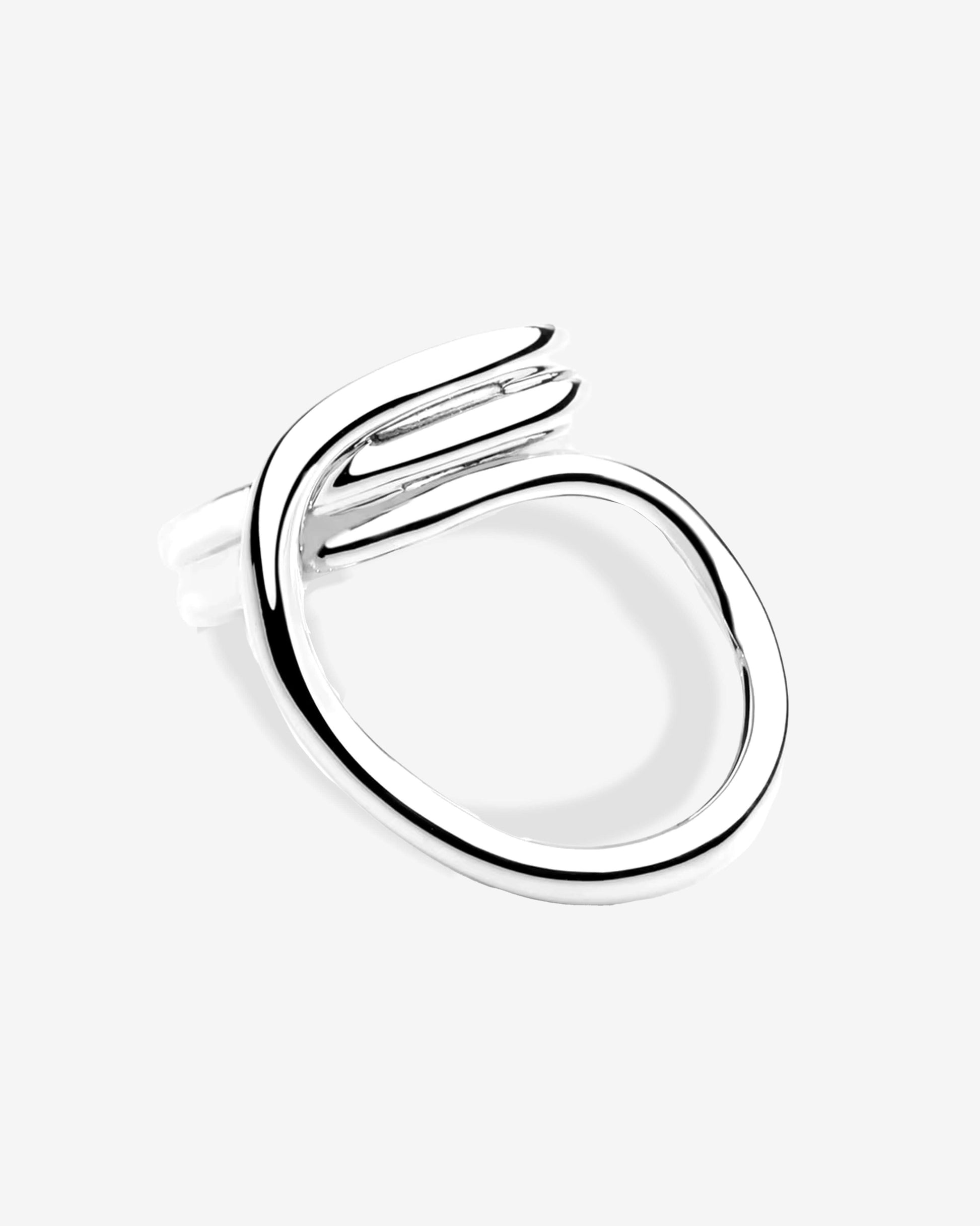 Sculptural open silver ring featuring a modern, fluid shape with soft curves and a polished mirror finish. This minimalist statement piece embodies contemporary elegance — clean lines, bold form, and effortless shine. Perfect for stacking or wearing solo, the ring reflects light beautifully and adds a refined touch to any modern jewelry collection.