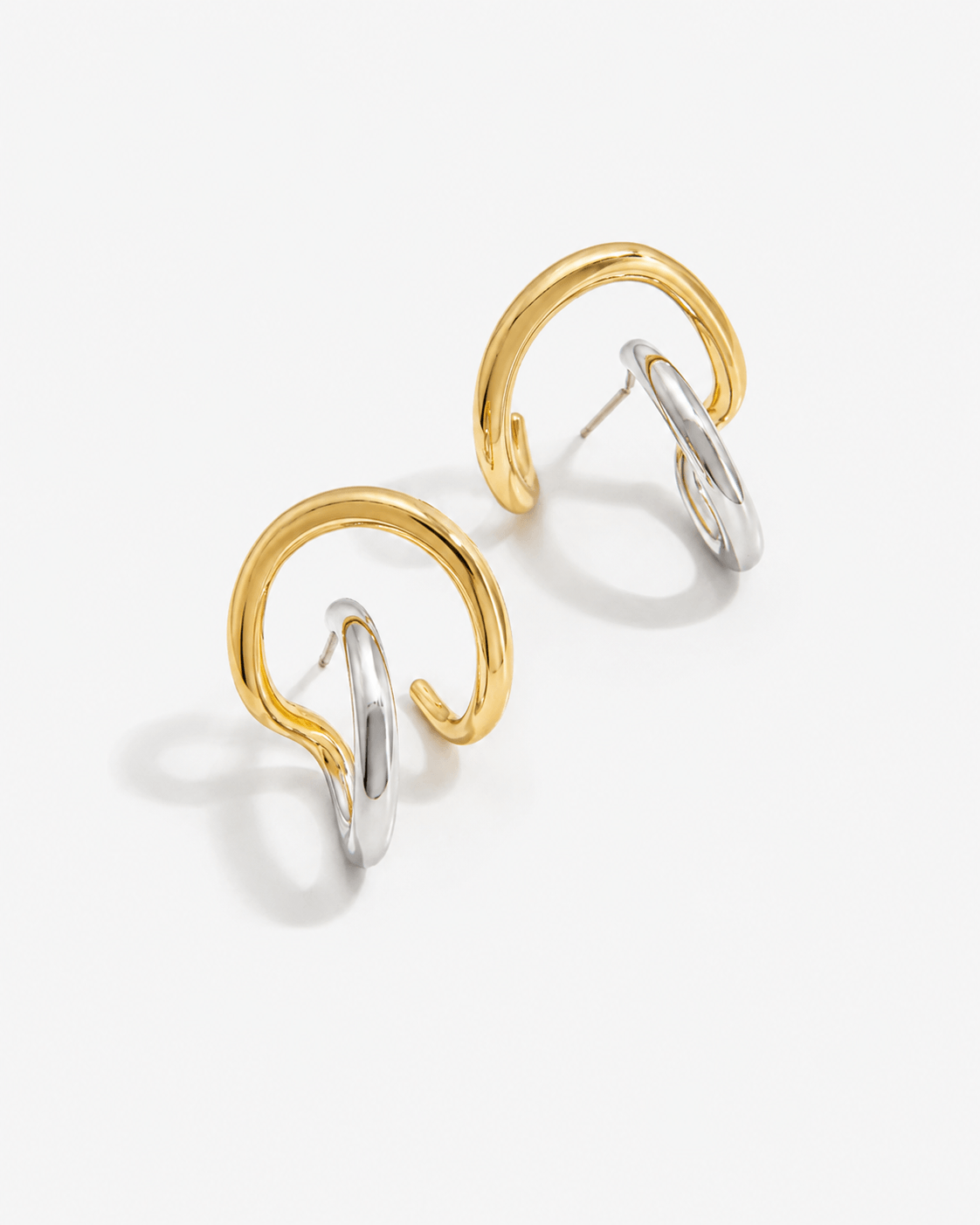 Two tone sculptural stud earrings in gold and silver finish, modern mixed metal statement earrings for women, abstract chunky stud earrings, contemporary minimalist jewelry, bold everyday earrings for casual or elevated styling