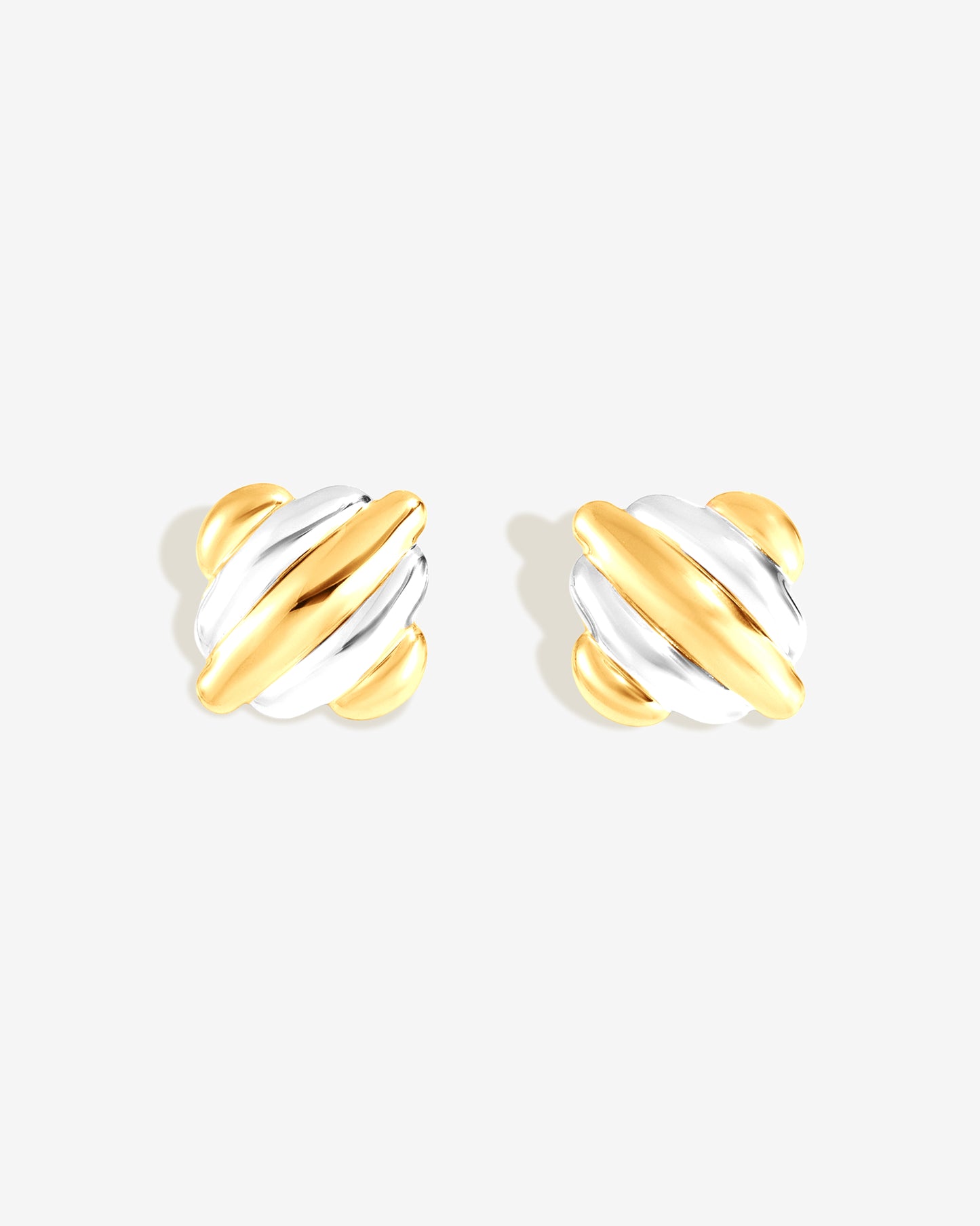 Chunky ribbed two-tone gold and silver square stud earrings with sculptural dome design for modern everyday wear.