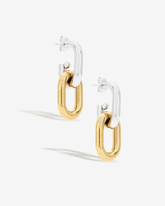 Two-tone link drop earrings with chunky silver and gold oval links stacked together. Modern statement earrings with sleek polished finish, lightweight and easy to wear. Perfect for everyday outfits or adding a chic, bold touch to evening looks. Contemporary geometric design ideal for fashion-forward styling.