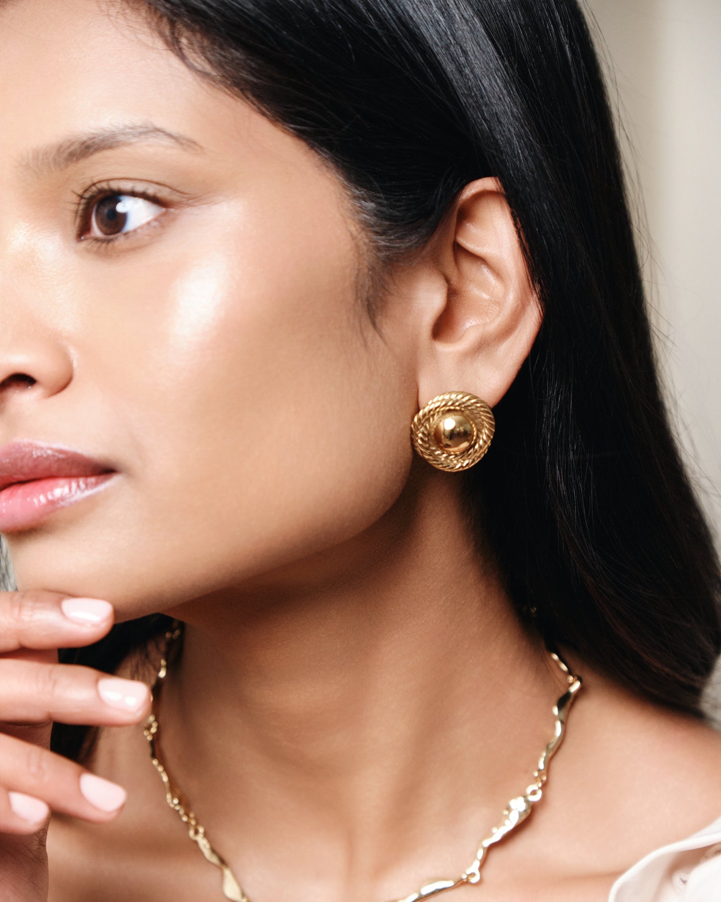 Gold rope dome stud earrings with textured twisted border and polished finish