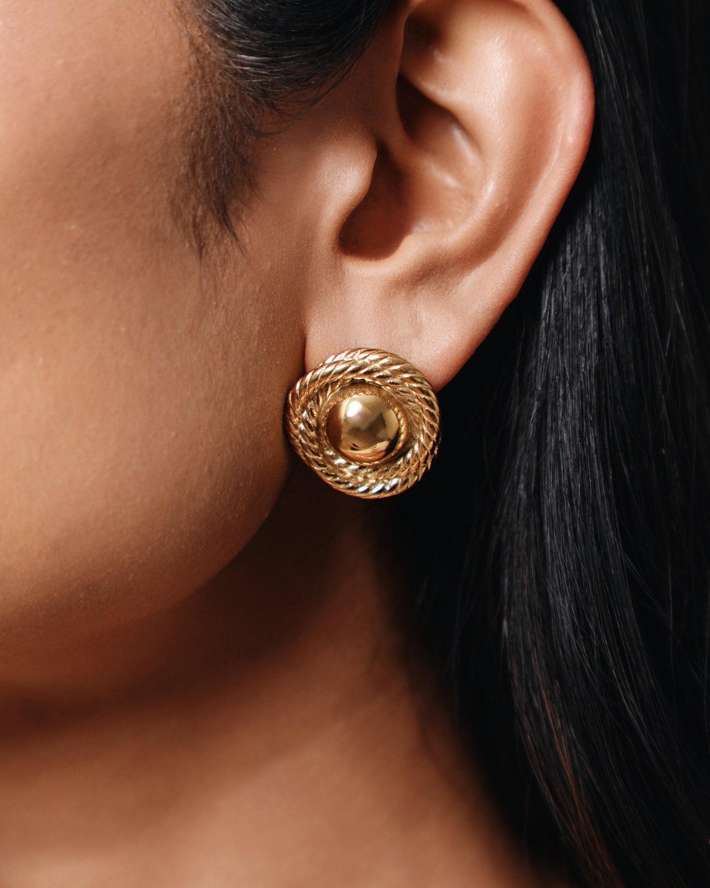 Gold rope dome stud earrings with textured twisted border and polished gold finish